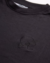 Black crew neck  with a small embroidered logo on a plain background