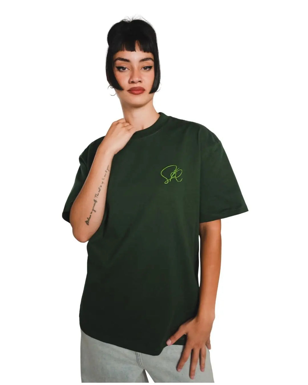 Person wearing the green core t-shirt with a logo on a white background