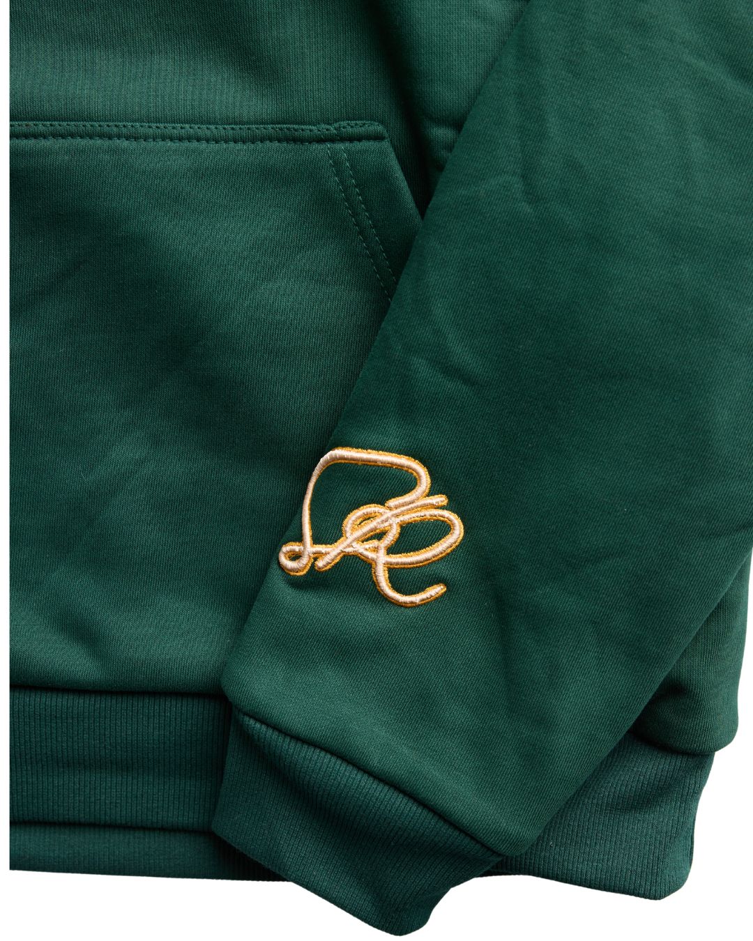 Green sweatshirt with a gold logo on a white background