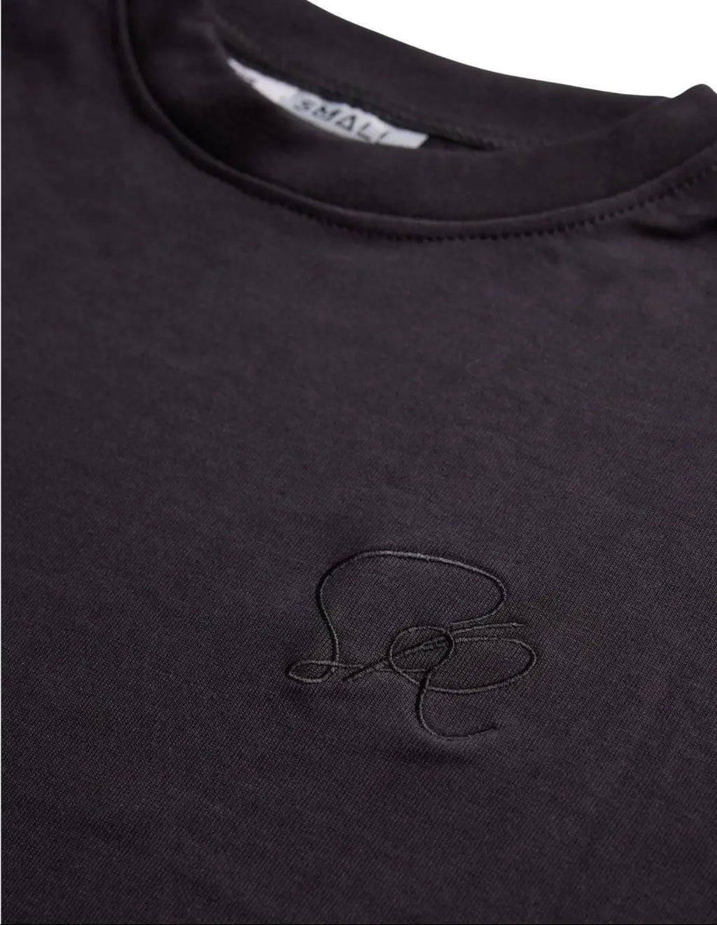 Black core t-shirt with a small embroidered logoon the chest.