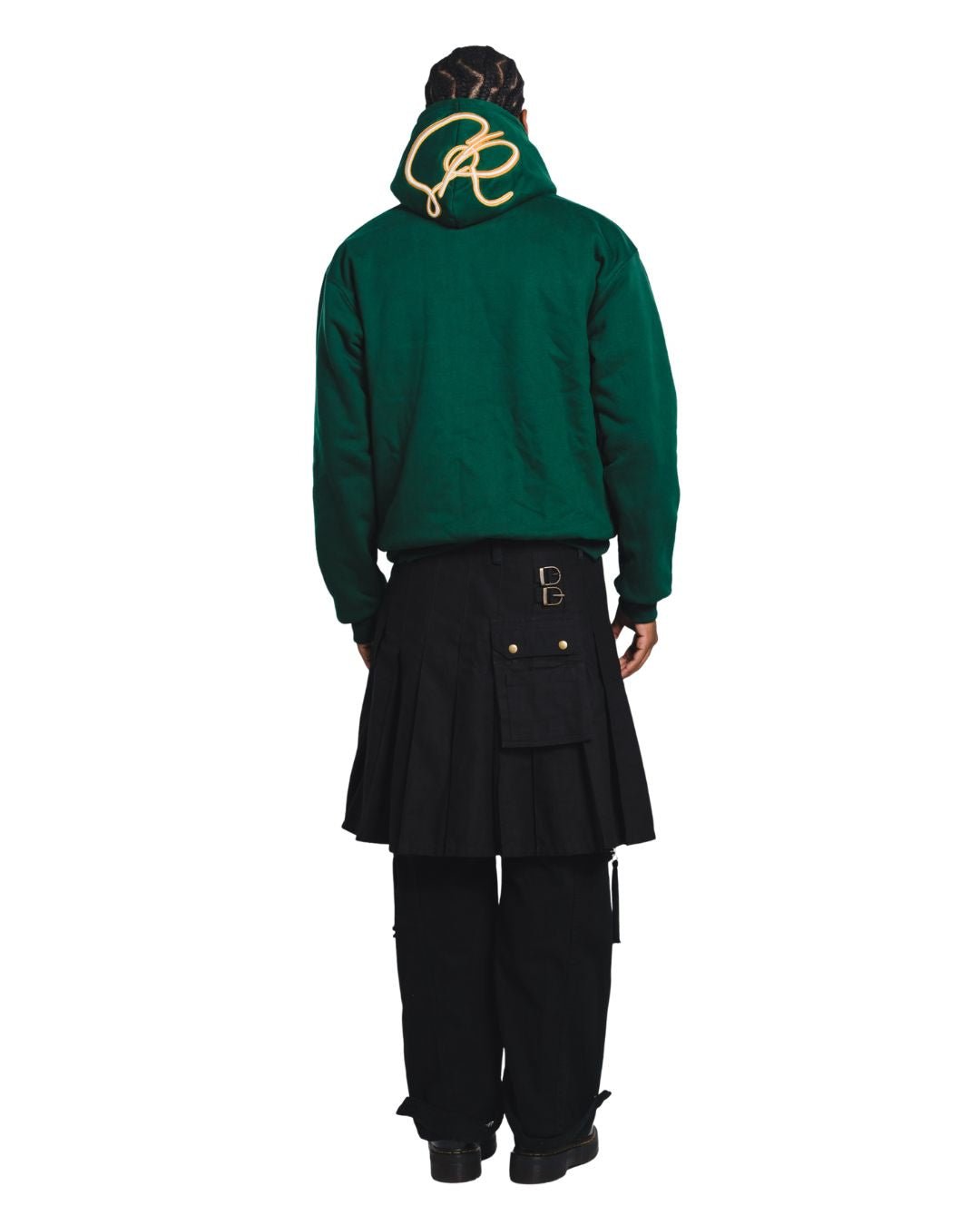 Person wearing a green hoodie facing backwards exposing the embroidery and black skirt on a white background