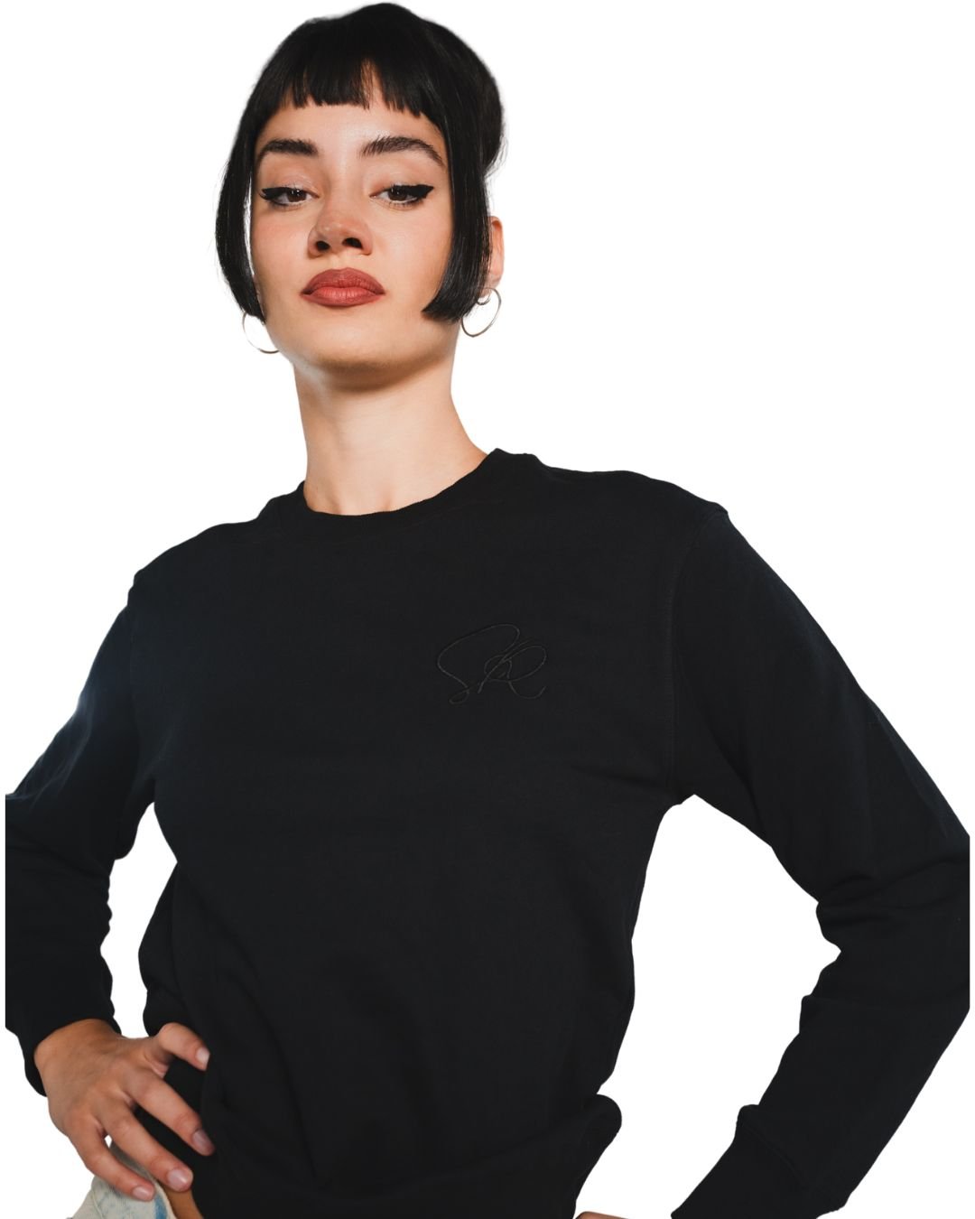 Person wearing a black crew neck sweatshirt with a logo on a white background